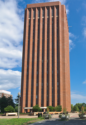 The UMass library, a tall brick building with vertical columns